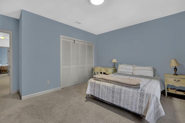 carpeted bedroom with a closet