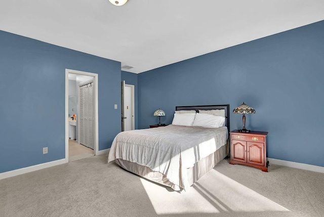 bedroom with light colored carpet and a closet