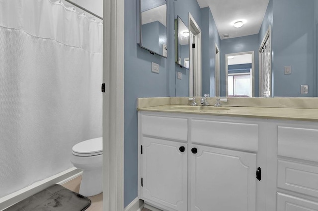 bathroom with vanity and toilet