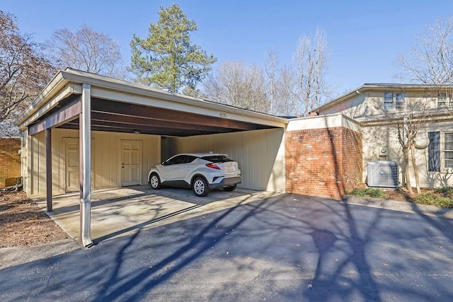 view of vehicle parking with a carport