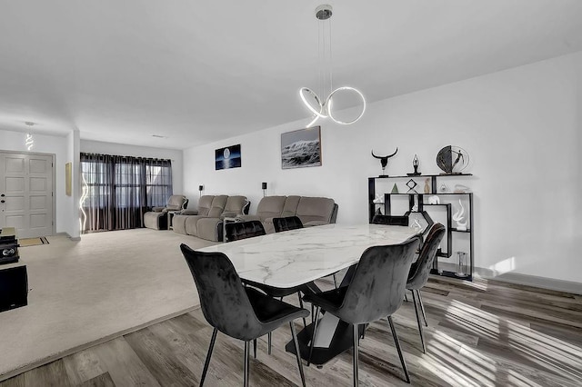 dining area with hardwood / wood-style floors