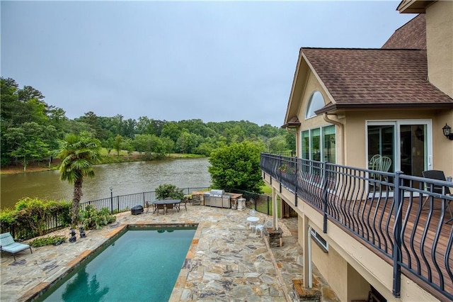 2675 Portabella Ln, Cumming, GA 30041 - view of swimming pool featuring a water view, a patio area, and a forest view