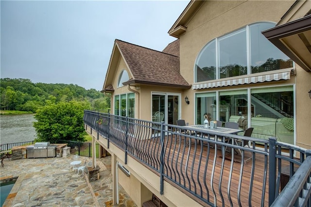 2675 Portabella Ln, Cumming, GA 30041 - view of patio / terrace featuring a water view, exterior kitchen, and outdoor dining space