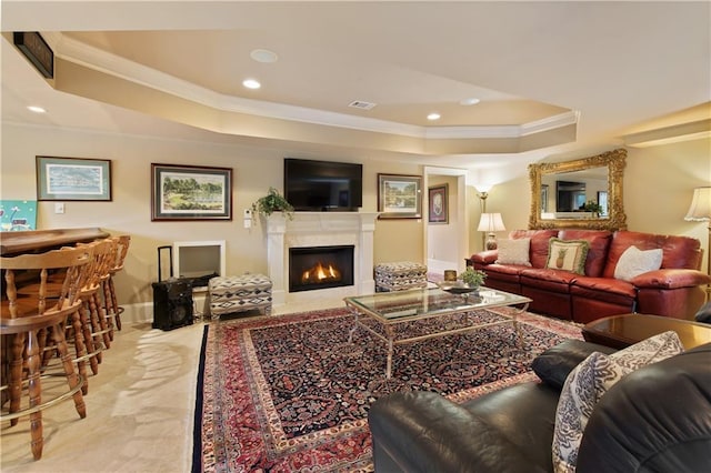 2675 Portabella Ln, Cumming, GA 30041 - living room featuring a tray ceiling, ornamental molding, a lit fireplace, baseboards, and recessed lighting