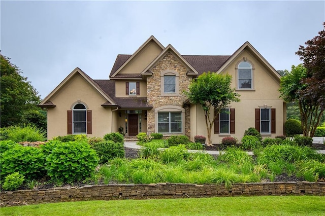 2675 Portabella Ln, Cumming, GA 30041 - traditional-style home with stucco siding and stone siding