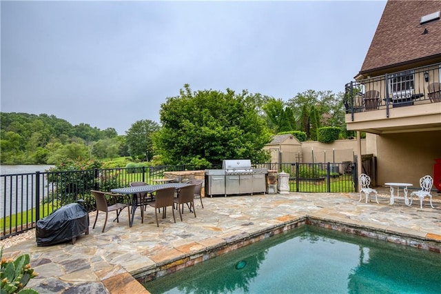 2675 Portabella Ln, Cumming, GA 30041 - view of swimming pool with area for grilling, a patio area, and outdoor dining space