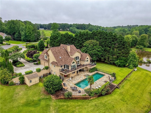 2675 Portabella Ln, Cumming, GA 30041 - view of subject property featuring a pool area and a large body of water