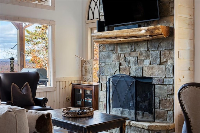 living room with a healthy amount of sunlight and a fireplace