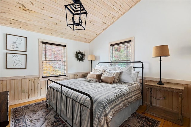 bedroom with high vaulted ceiling, wood ceiling, and wood-type flooring