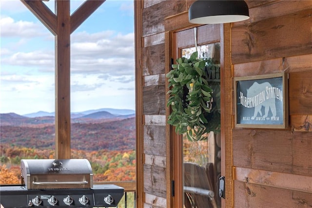 interior details featuring wood walls and a mountain view