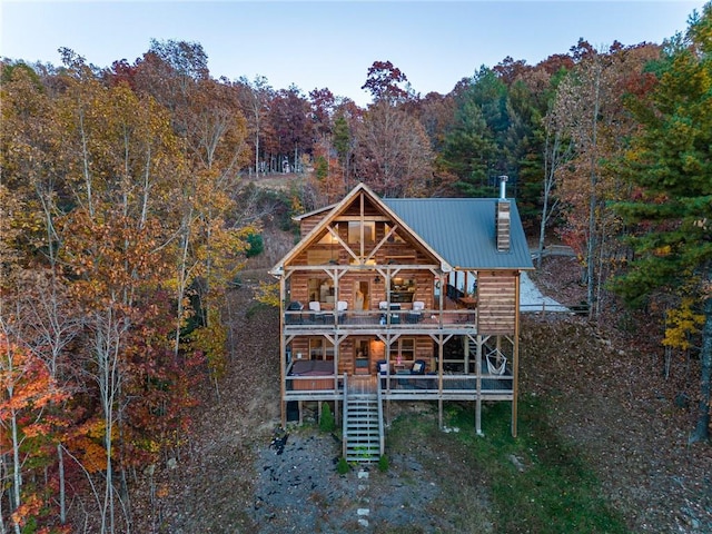 back of house featuring a deck