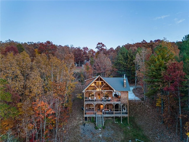 back of house featuring a wooden deck