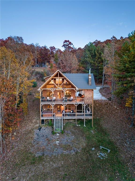 rear view of house with a wooden deck