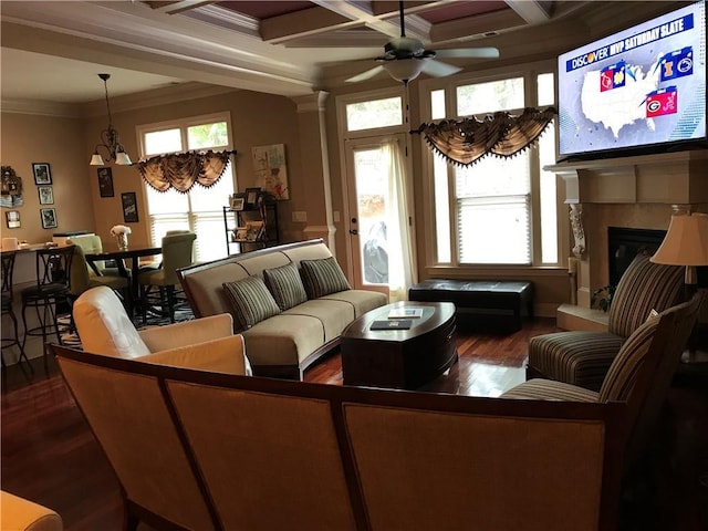 1175 Grassy Oat Ln, Lawrenceville, GA 30045 - living room featuring a ceiling fan, dark wood-style floors, ornamental molding, plenty of natural light, and beam ceiling