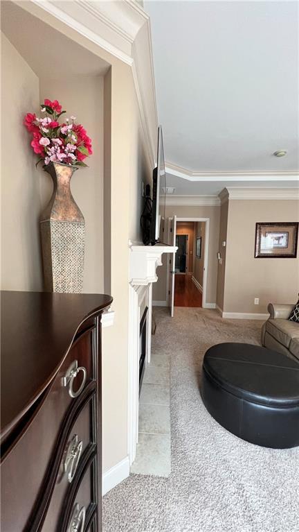 1175 Grassy Oat Ln, Lawrenceville, GA 30045 - living area featuring crown molding and light colored carpet