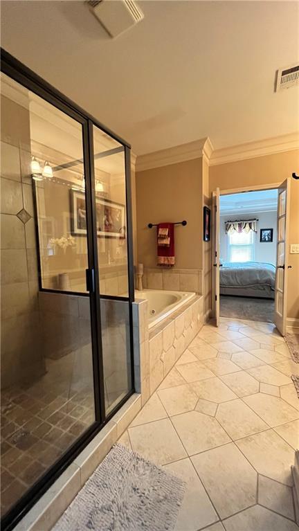 1175 Grassy Oat Ln, Lawrenceville, GA 30045 - bathroom with crown molding, tile patterned floors, a whirlpool tub, a stall shower, and connected bathroom