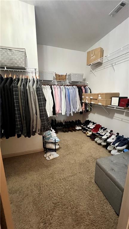 1175 Grassy Oat Ln, Lawrenceville, GA 30045 - walk in closet with carpet flooring