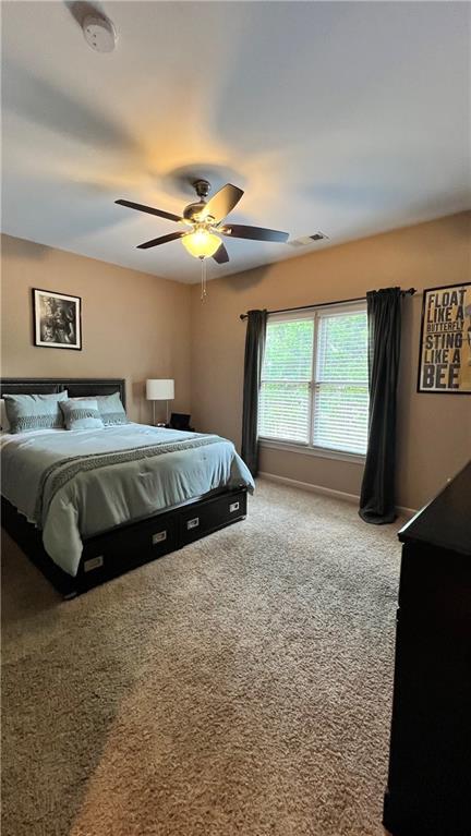 1175 Grassy Oat Ln, Lawrenceville, GA 30045 - bedroom featuring carpet floors and a ceiling fan