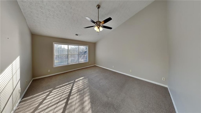 unfurnished room featuring baseboards, visible vents, vaulted ceiling, a textured ceiling, and carpet flooring