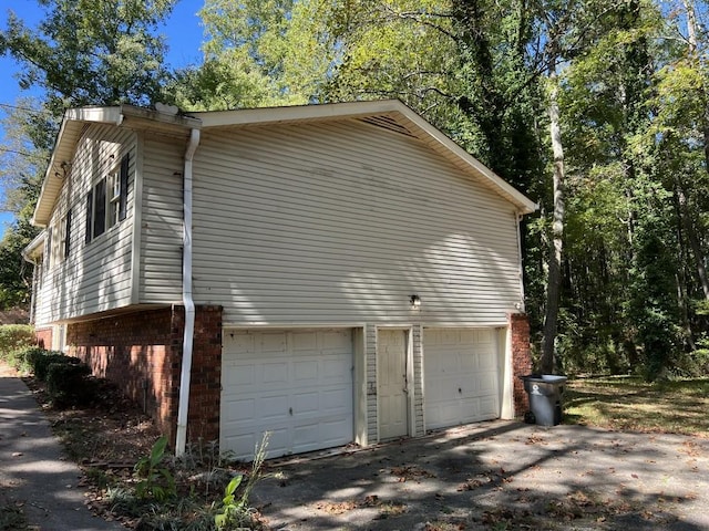 view of property exterior with a garage