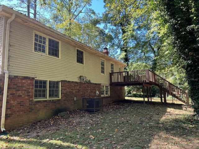 view of property exterior featuring a deck