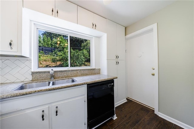 kitchen with white cabinetry, black dishwasher, dark hardwood / wood-style floors, backsplash, and sink