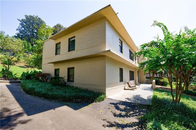 view of home's exterior with a patio area