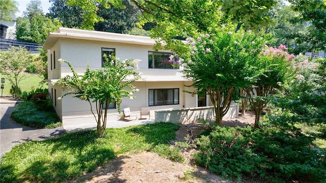 back of house featuring a garage