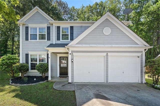 view of front of property featuring driveway and a garage