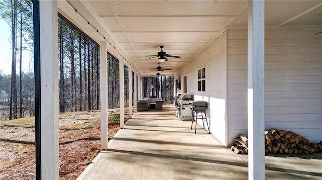 view of patio featuring ceiling fan