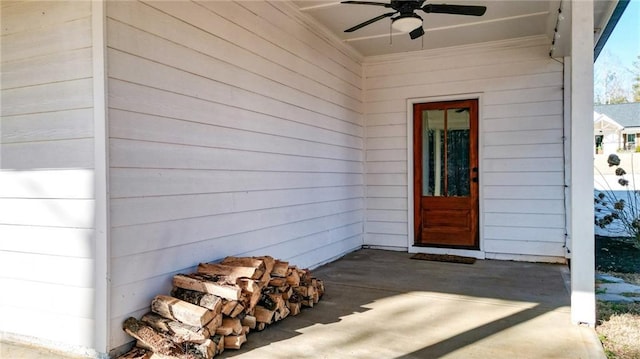 property entrance with a patio and ceiling fan