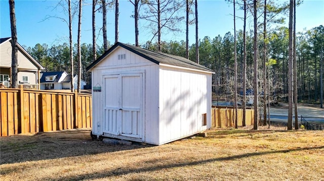 view of outdoor structure featuring a lawn