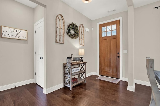 entryway with dark hardwood / wood-style floors