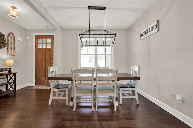 dining space with a notable chandelier and dark wood-type flooring