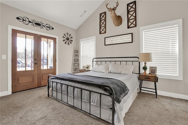 bedroom with carpet flooring, high vaulted ceiling, and french doors