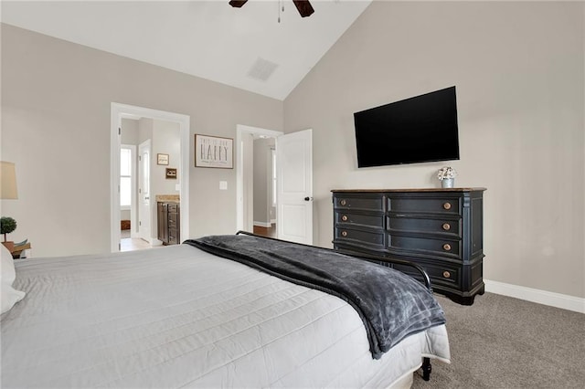 bedroom with ceiling fan, light colored carpet, connected bathroom, and high vaulted ceiling