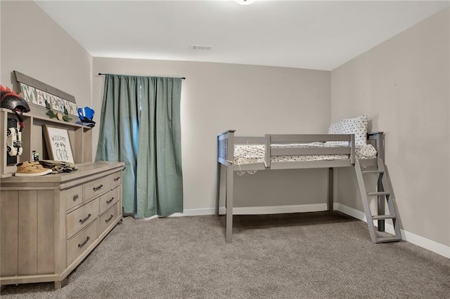 bedroom featuring light colored carpet