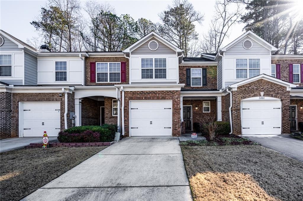 townhome / multi-family property featuring a garage