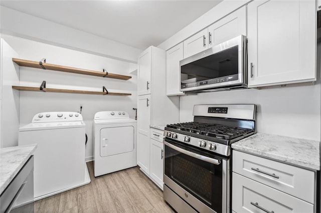 1379 Keys Lake Dr NE, Brookhaven, GA 30319 - kitchen with open shelves, separate washer and dryer, light wood finished floors, and stainless steel appliances