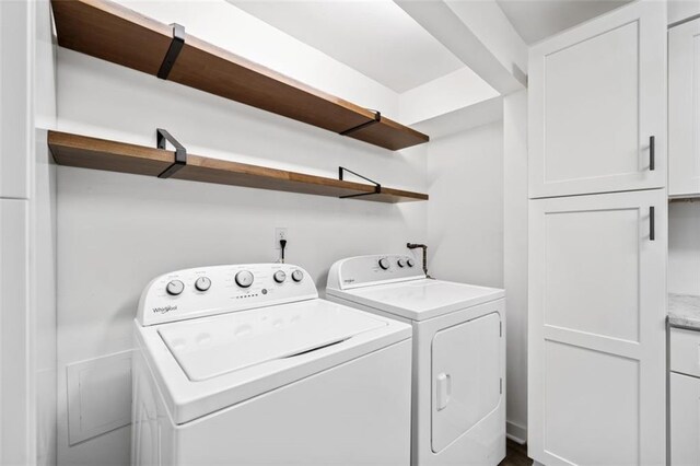 1379 Keys Lake Dr NE, Brookhaven, GA 30319 - washroom featuring washer and dryer and cabinet space