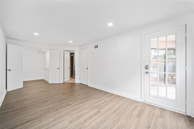 1379 Keys Lake Dr NE, Brookhaven, GA 30319 - empty room with recessed lighting, wood finished floors, visible vents, and baseboards