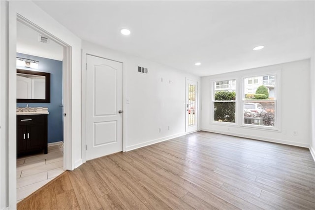 1379 Keys Lake Dr NE, Brookhaven, GA 30319 - spare room with visible vents, recessed lighting, light wood-type flooring, and baseboards