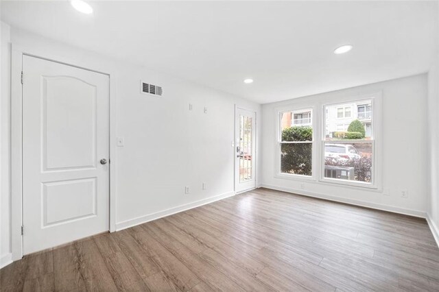 1379 Keys Lake Dr NE, Brookhaven, GA 30319 - spare room featuring recessed lighting, visible vents, baseboards, and wood finished floors