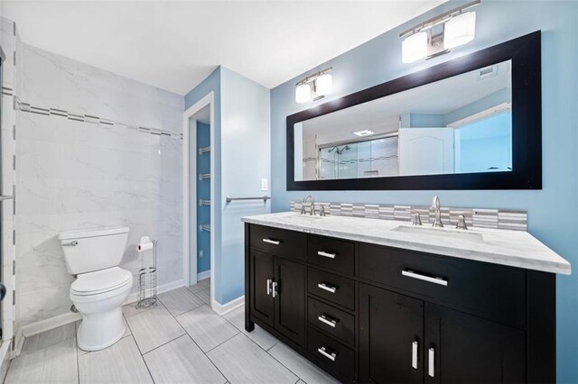 1379 Keys Lake Dr NE, Brookhaven, GA 30319 - full bath featuring double vanity, a shower with door, toilet, and a sink