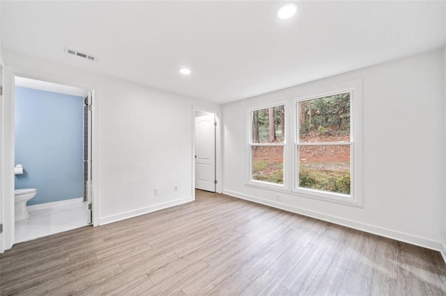 1379 Keys Lake Dr NE, Brookhaven, GA 30319 - unfurnished room with recessed lighting, baseboards, and wood finished floors