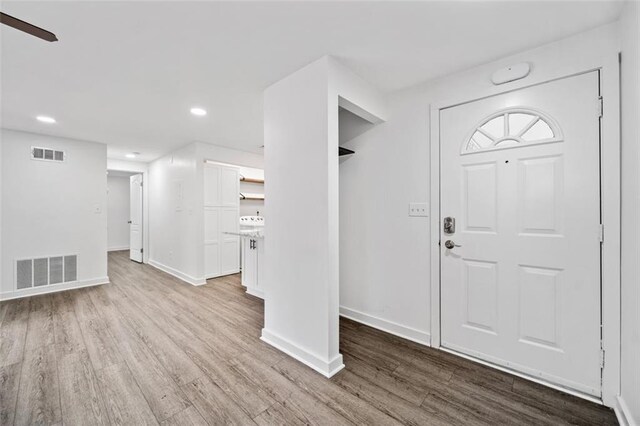1379 Keys Lake Dr NE, Brookhaven, GA 30319 - foyer entrance with visible vents, baseboards, and wood finished floors