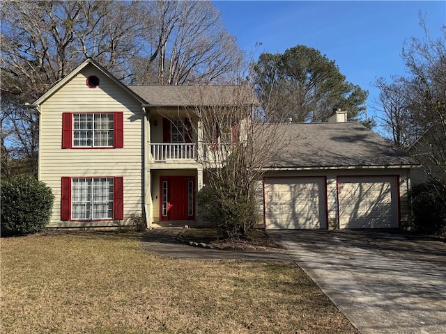 front facade with a balcony, a garage, and a front lawn