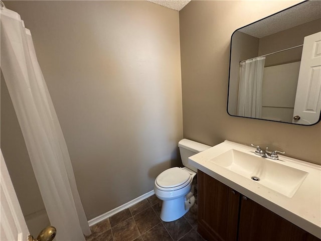 bathroom featuring a shower with curtain, tile patterned floors, a textured ceiling, toilet, and vanity