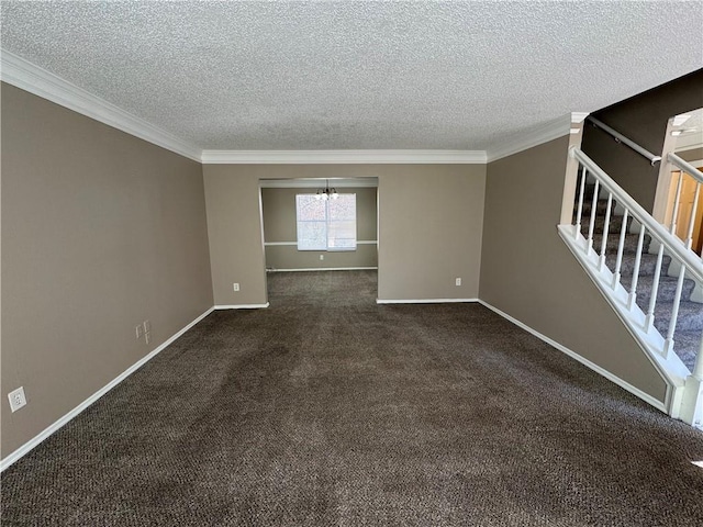 empty room with crown molding, dark colored carpet, a textured ceiling, and an inviting chandelier