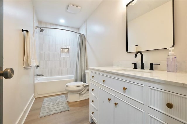 455 Saddle Bow Dr, Lawrenceville, GA 30046 - bathroom with toilet, vanity, shower / bath combination with curtain, and wood finished floors